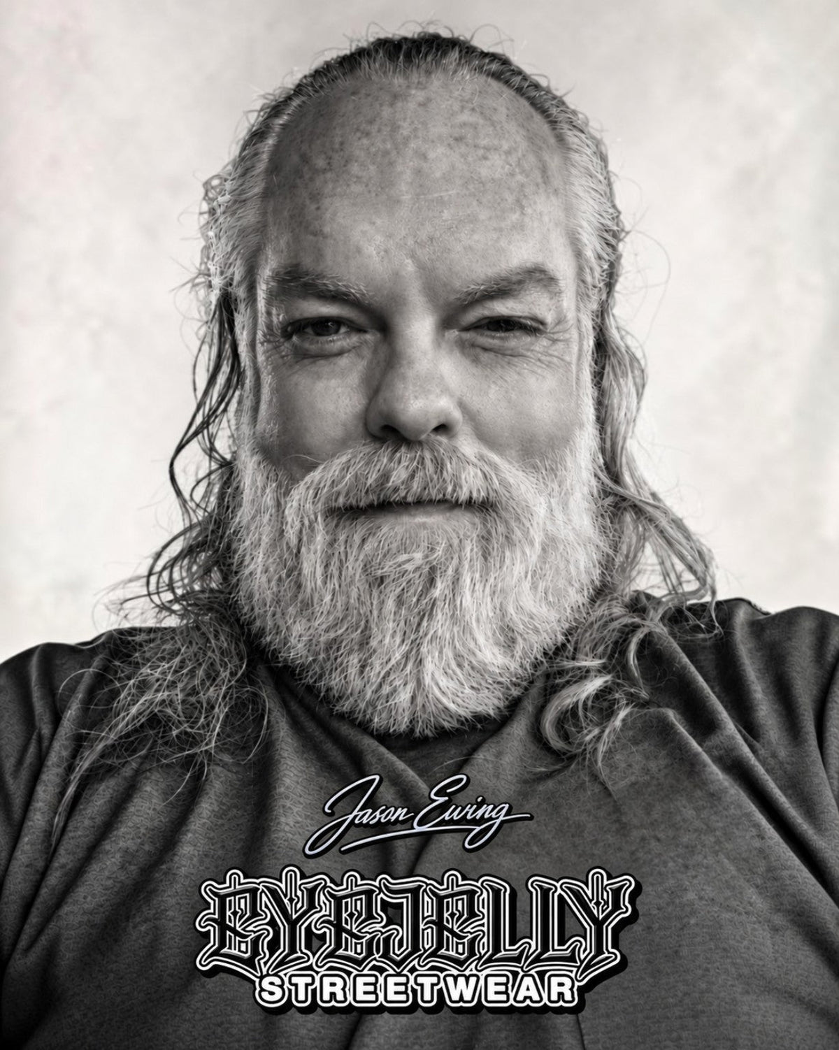 Black-and-white portrait of Jason Ewing wearing an EyeJelly Streetwear shirt.
