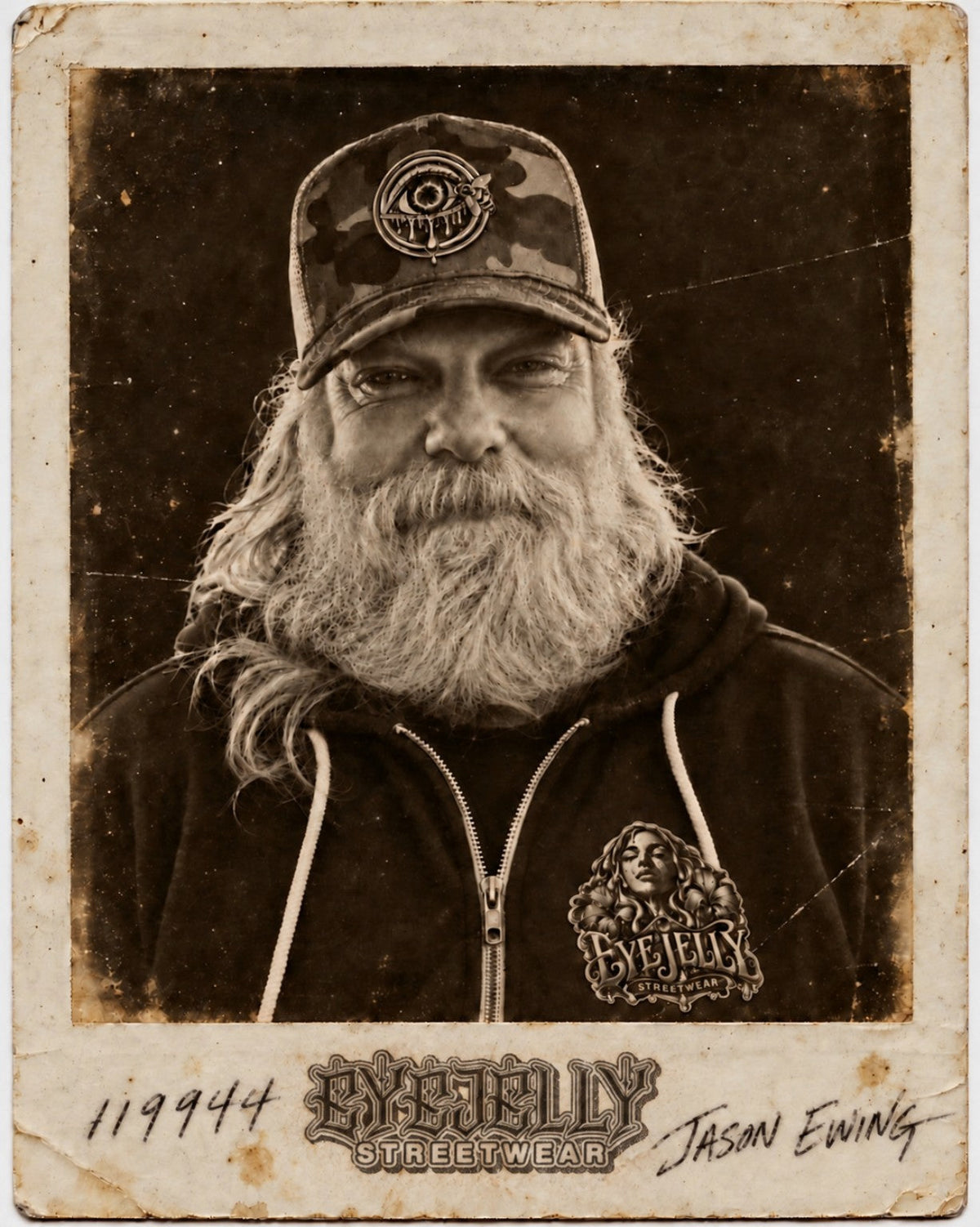 Sepia portrait of Jason Ewing wearing EyeJelly Streetwear, framed like a worn vintage photograph.
